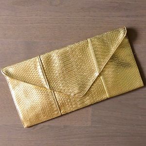 Gold snake clutch bag